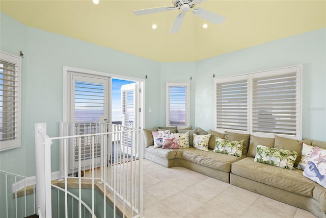 living room featuring light tile patterned flooring and ceiling fan