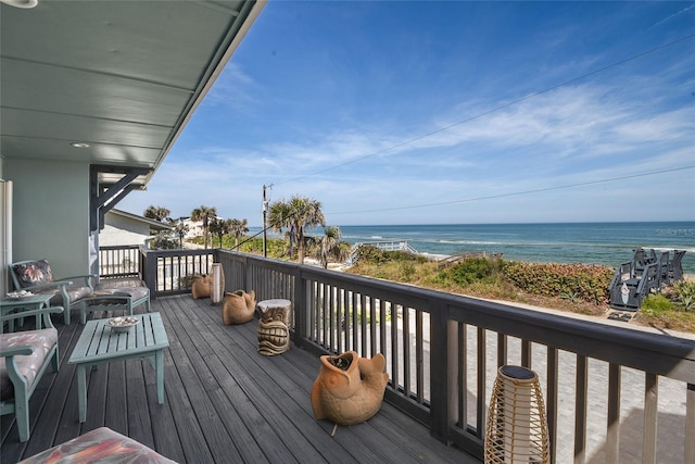 wooden terrace featuring a water view