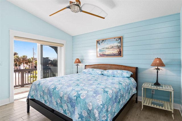 bedroom with hardwood / wood-style flooring, ceiling fan, vaulted ceiling, and access to outside