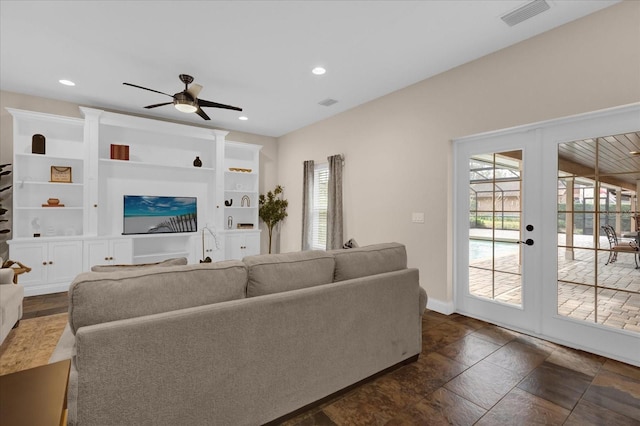 living room featuring plenty of natural light, french doors, and ceiling fan