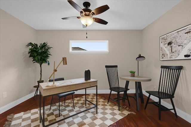 home office featuring hardwood / wood-style floors and ceiling fan