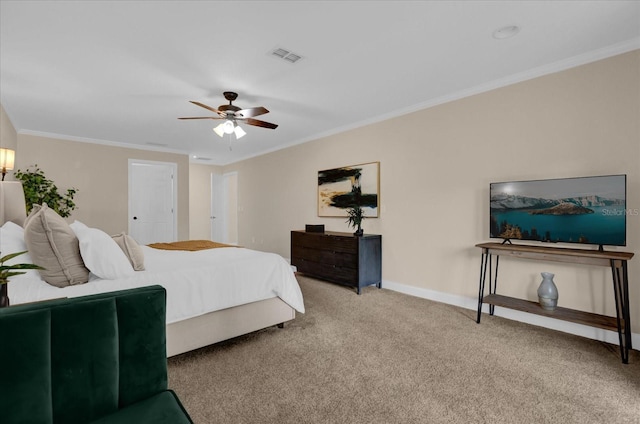 carpeted bedroom with ceiling fan and ornamental molding