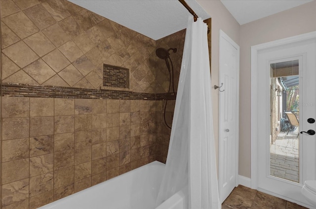 bathroom featuring shower / tub combo with curtain