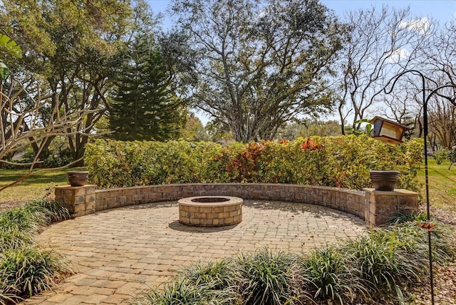 view of patio / terrace with a fire pit