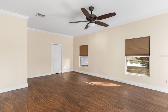 unfurnished room with dark hardwood / wood-style flooring, crown molding, and ceiling fan