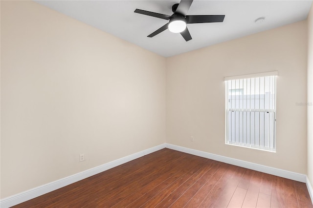 unfurnished room with dark wood-type flooring and ceiling fan