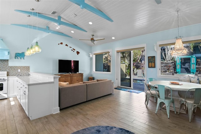 living room featuring vaulted ceiling with beams, wooden ceiling, ceiling fan, and light wood-type flooring