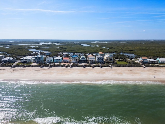 bird's eye view with a water view and a view of the beach