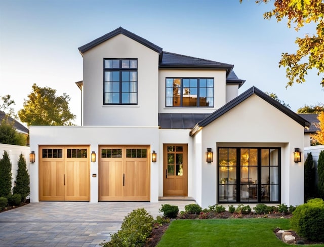 view of front facade featuring a garage and a front lawn