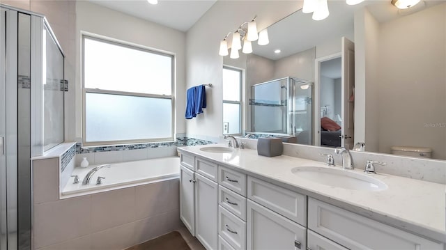 full bathroom with vanity, toilet, and plus walk in shower