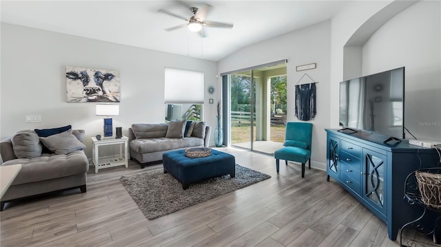 living room featuring ceiling fan and light hardwood / wood-style floors