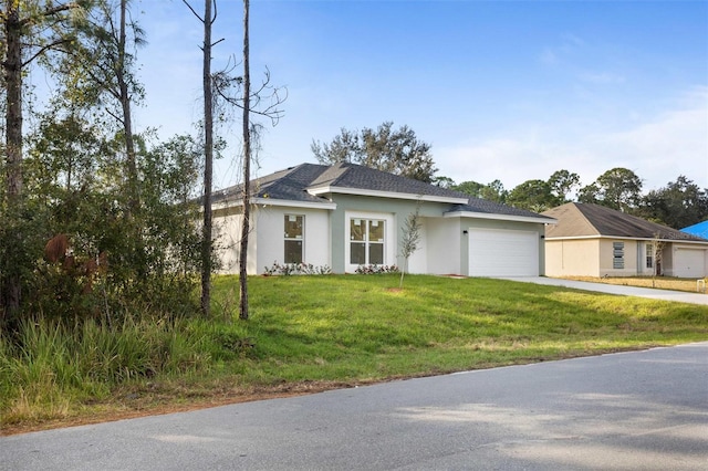 view of front of house featuring a garage and a front yard