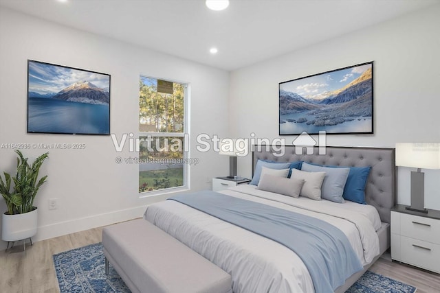 bedroom with light hardwood / wood-style floors