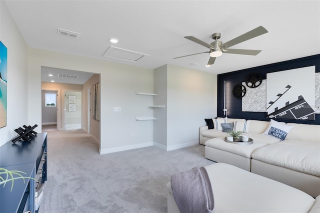 living room featuring ceiling fan and light colored carpet