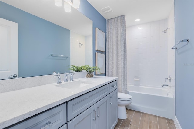 full bathroom with shower / bathing tub combination, vanity, and toilet