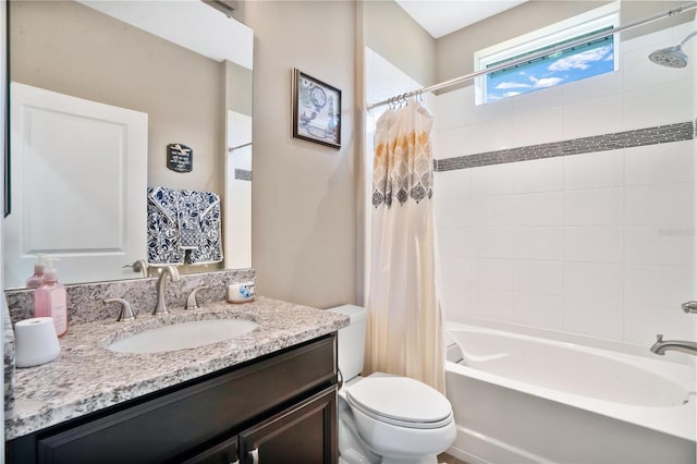 full bathroom featuring vanity, shower / bath combination with curtain, and toilet