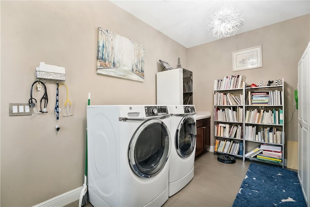 laundry room featuring washing machine and clothes dryer