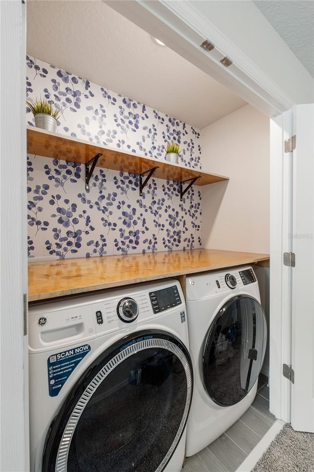 washroom with laundry area and independent washer and dryer