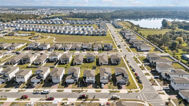 bird's eye view with a water view and a residential view