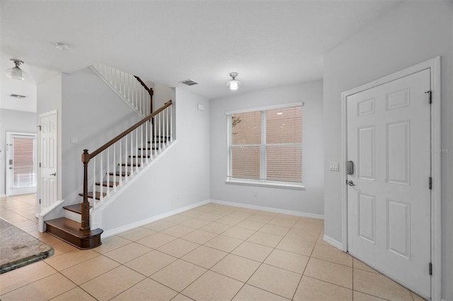 foyer with light tile patterned flooring