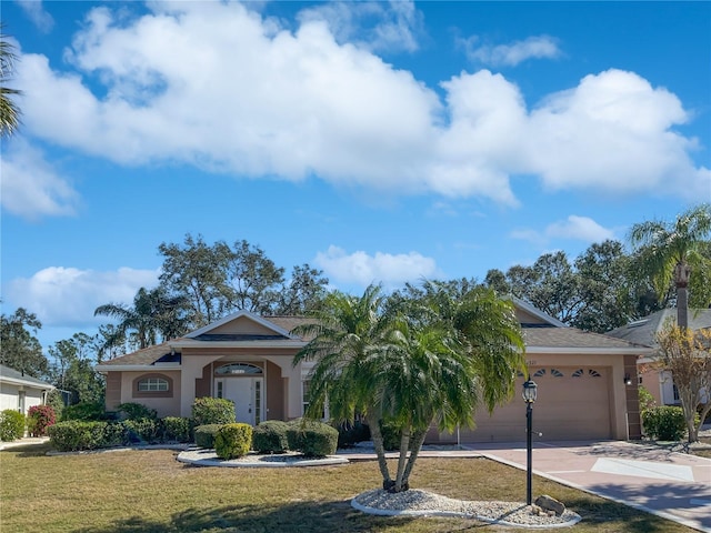 ranch-style home featuring a garage and a front yard