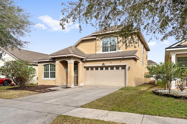 view of front of house featuring a garage and a front lawn