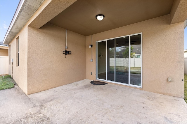 property entrance with a patio area