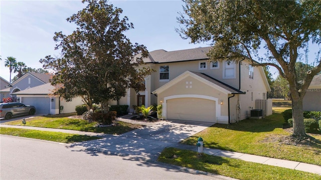 view of front facade featuring a garage, central AC unit, and a front lawn