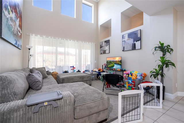 tiled living room with a towering ceiling