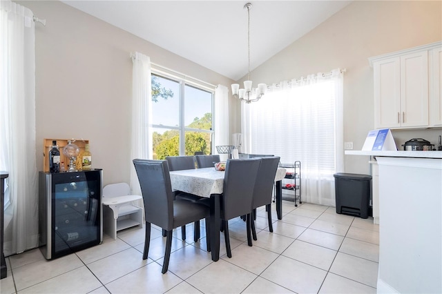 dining area featuring wine cooler, light tile patterned floors, lofted ceiling, and an inviting chandelier