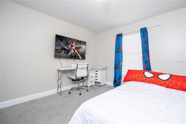 bedroom with carpet flooring and a textured ceiling