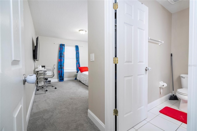 bathroom with tile patterned floors and toilet