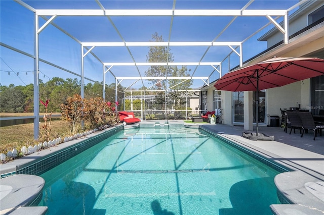 view of pool featuring a lanai and a patio area