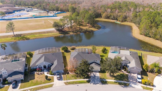 birds eye view of property with a water view