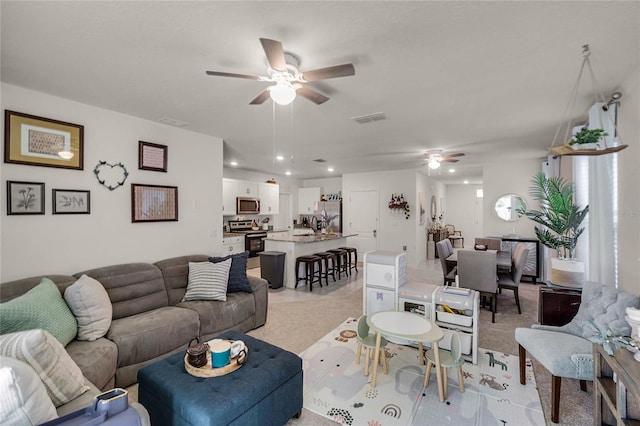 living room with ceiling fan