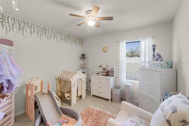 bedroom featuring light carpet and ceiling fan