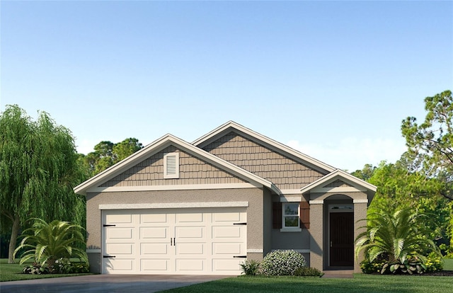 view of front facade featuring a garage and a front yard