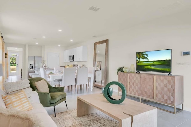 living room with light tile patterned floors