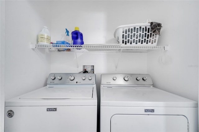 washroom featuring independent washer and dryer and laundry area