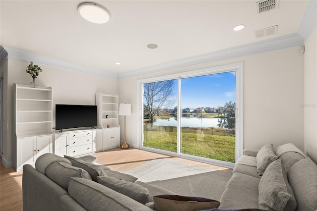 living room with hardwood / wood-style flooring and ornamental molding