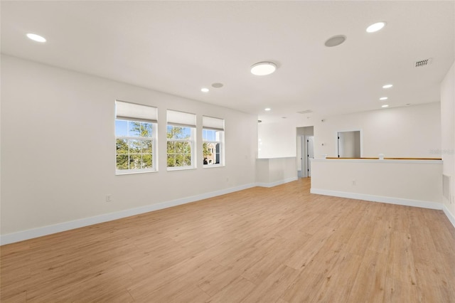 unfurnished living room featuring light hardwood / wood-style floors