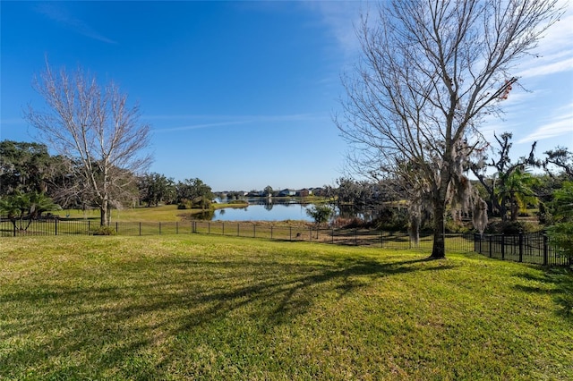 view of yard with a water view and a rural view