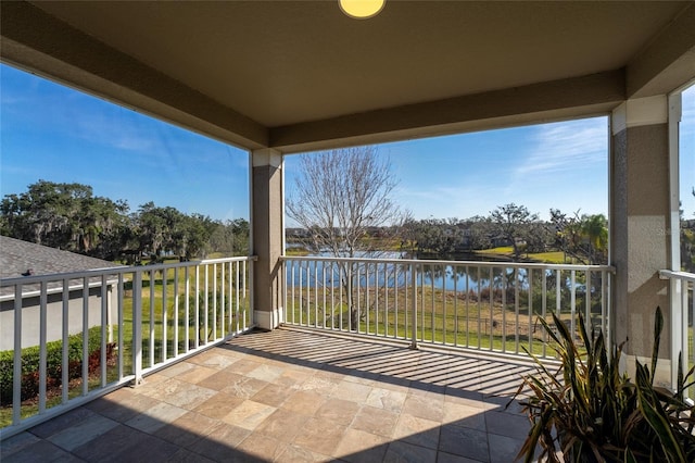 balcony featuring a water view