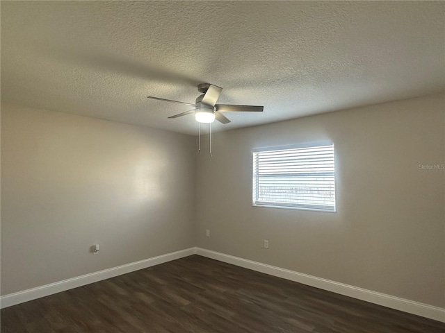 unfurnished room with ceiling fan, a textured ceiling, and dark hardwood / wood-style flooring