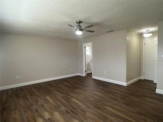 unfurnished room with ceiling fan, a textured ceiling, and dark hardwood / wood-style flooring