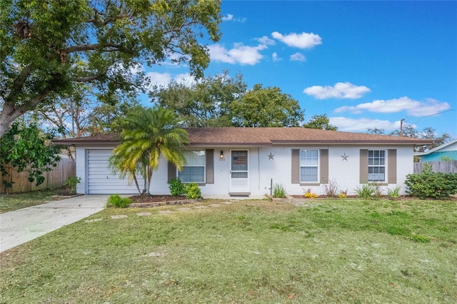 single story home featuring a garage and a front yard