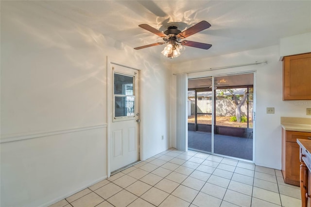 interior space featuring ceiling fan and light tile patterned flooring