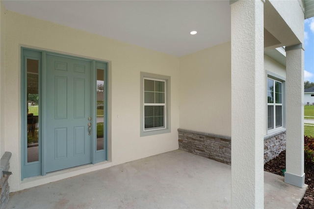 entrance to property with a patio