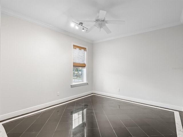 spare room featuring ornamental molding and ceiling fan