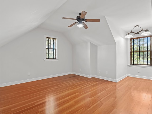 bonus room with ceiling fan, vaulted ceiling, and light hardwood / wood-style flooring